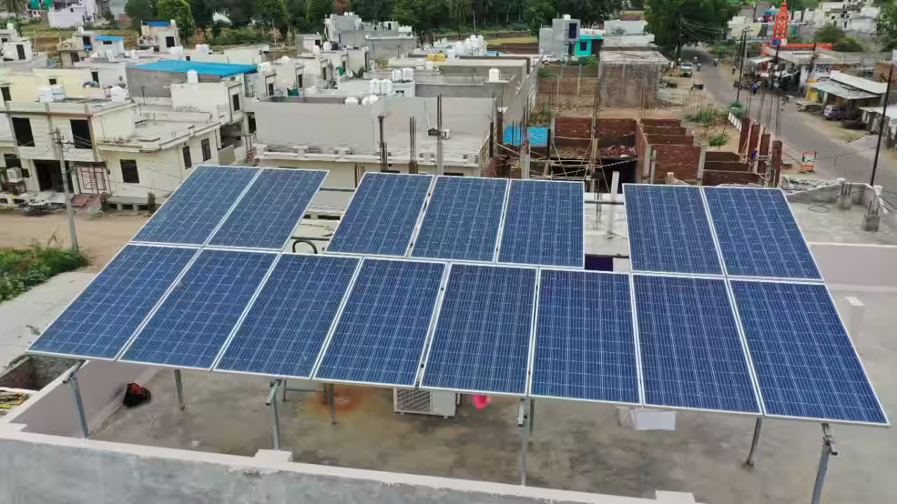 Aerial view of a solar power plant in Kota, Rajasthan, with extensive solar panel installations for sustainable energy.